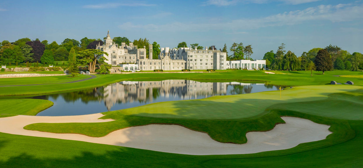 A green, water and the manor house on the closing stretch at Adare Manor