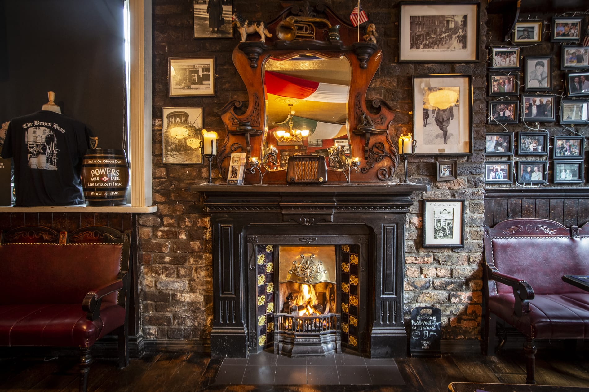 The lounge fireplace and carved mirror at The Brazen Head