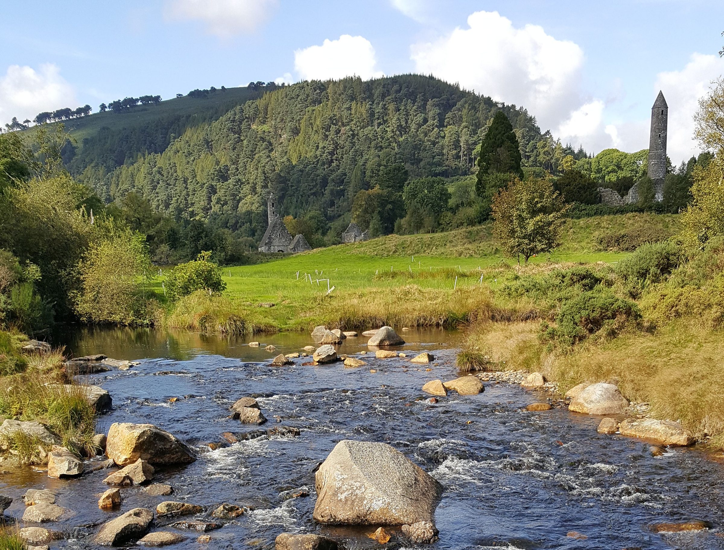 The round tower and river valley at Glendalough, County Wicklow