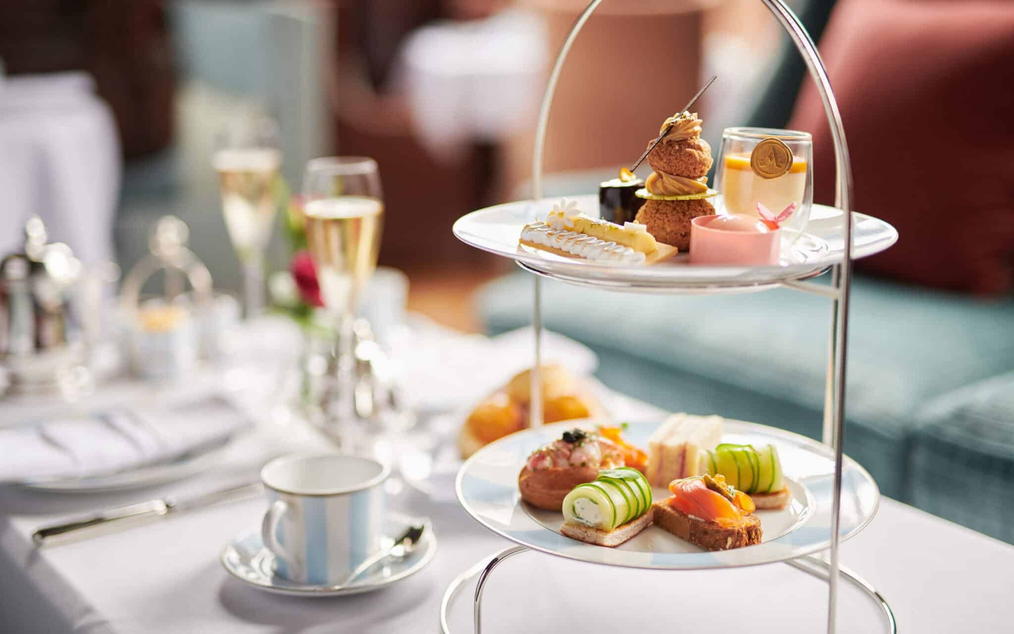 Afternoon tea on tiered stands with a glass of Champagne at Adare Manor