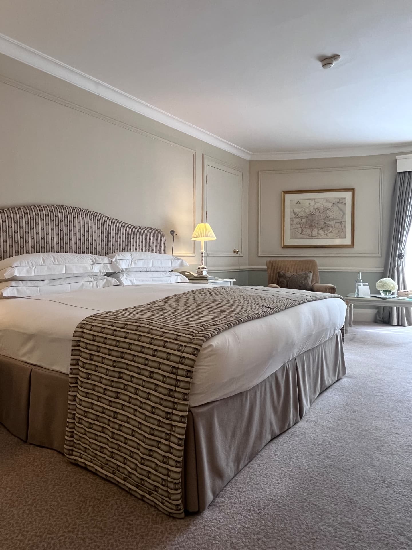 Deborah's room at The Merrion, with pale Georgian panelling and a patterned upholstered bed