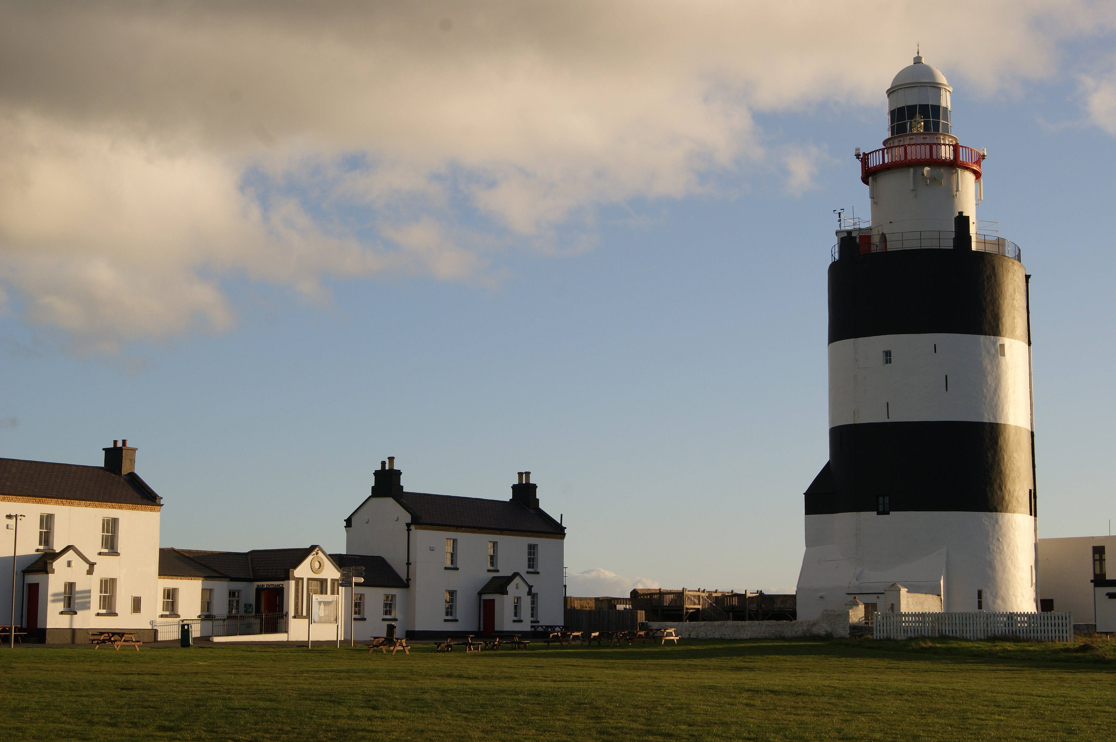 The black and white banded Hook Head lighthouse on the flat limestone point, County Wexford
