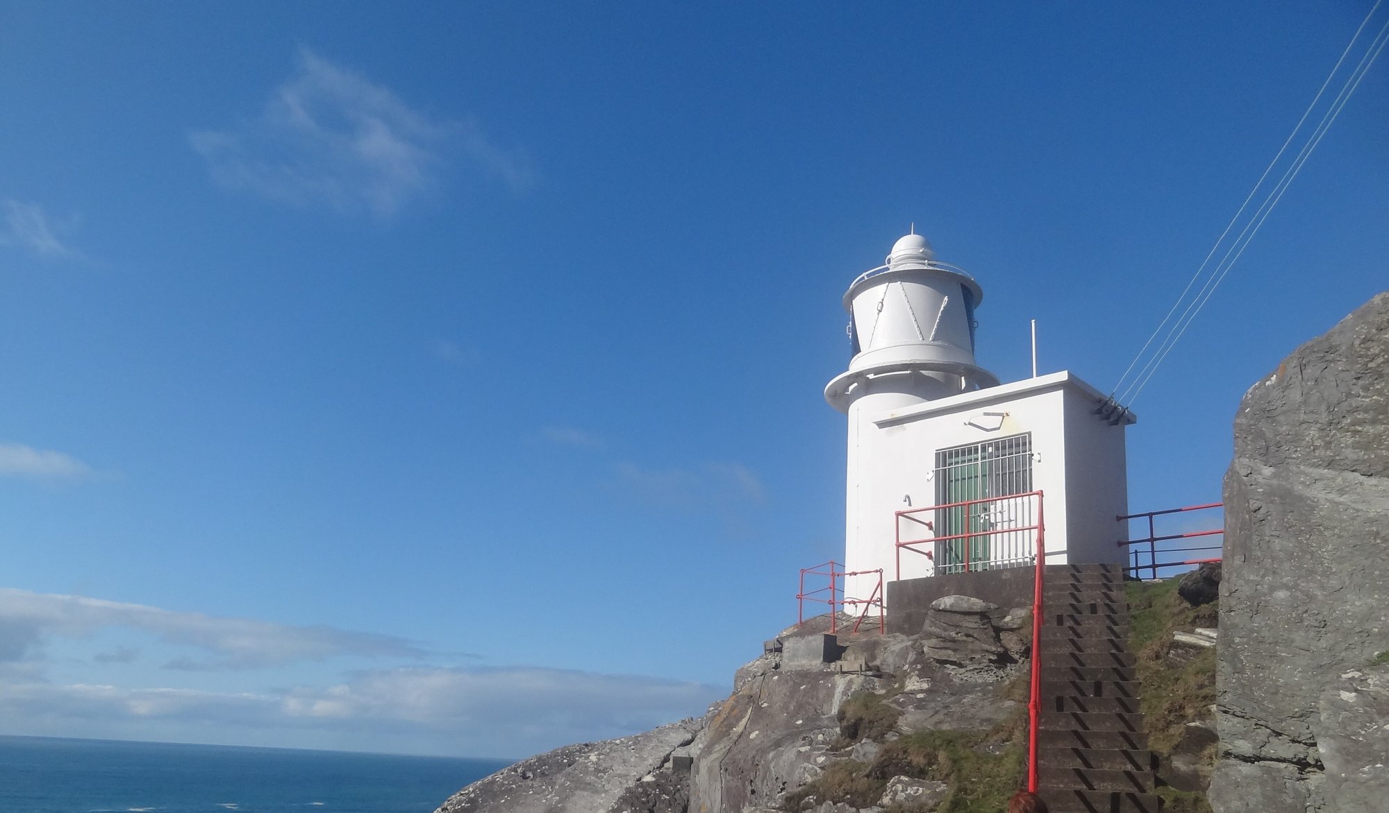 Sheep's Head Lighthouse on the rocks at the tip of the Sheep's Head peninsula, West Cork
