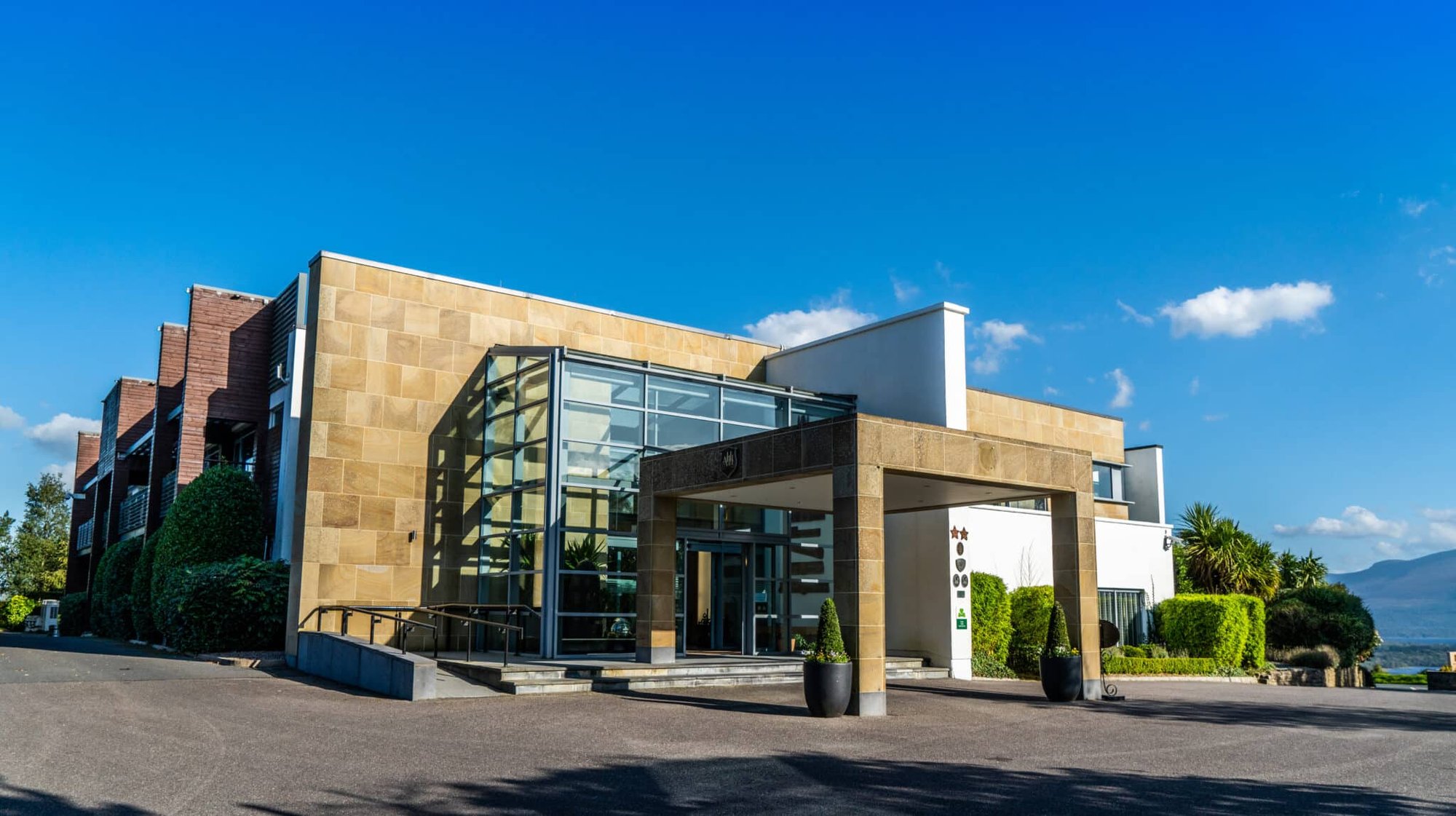Front entrance and sandstone facade of Aghadoe Heights Hotel & Spa in Killarney, County Kerry