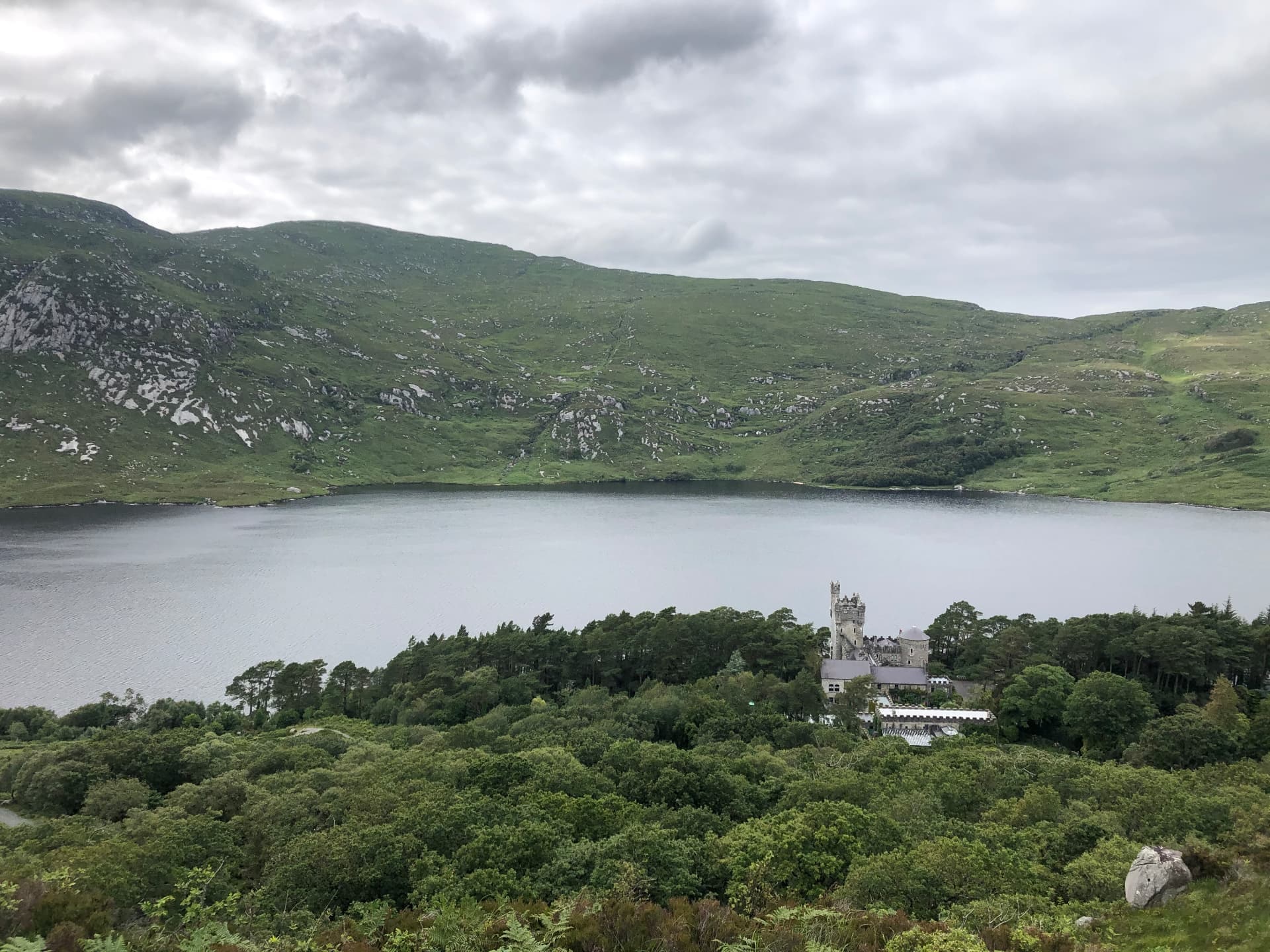 Glenveagh Castle on the shore of Lough Veagh, seen from the hillside above, County Donegal