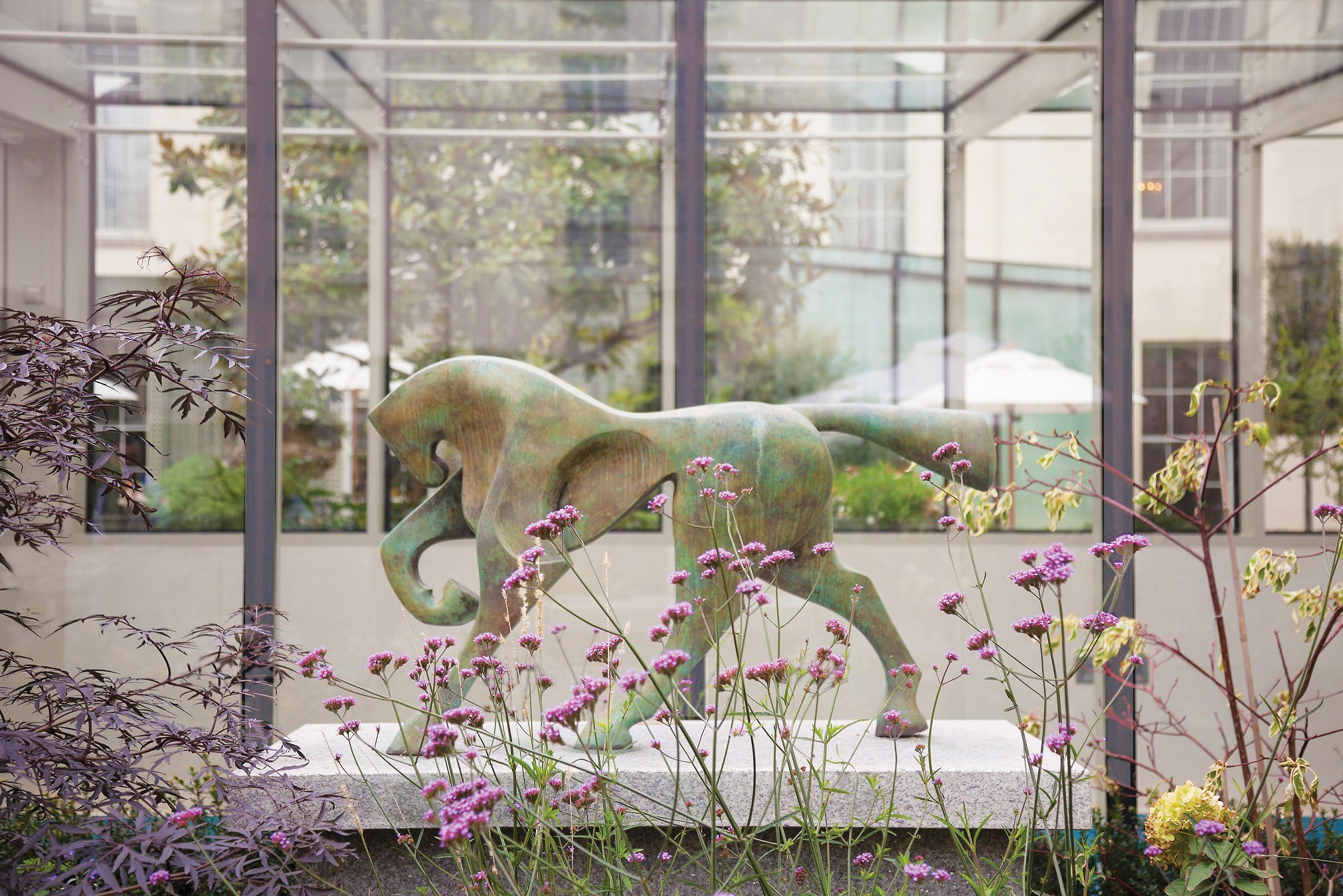 Sculpture and flowers in the garden at The Merrion Hotel, Dublin