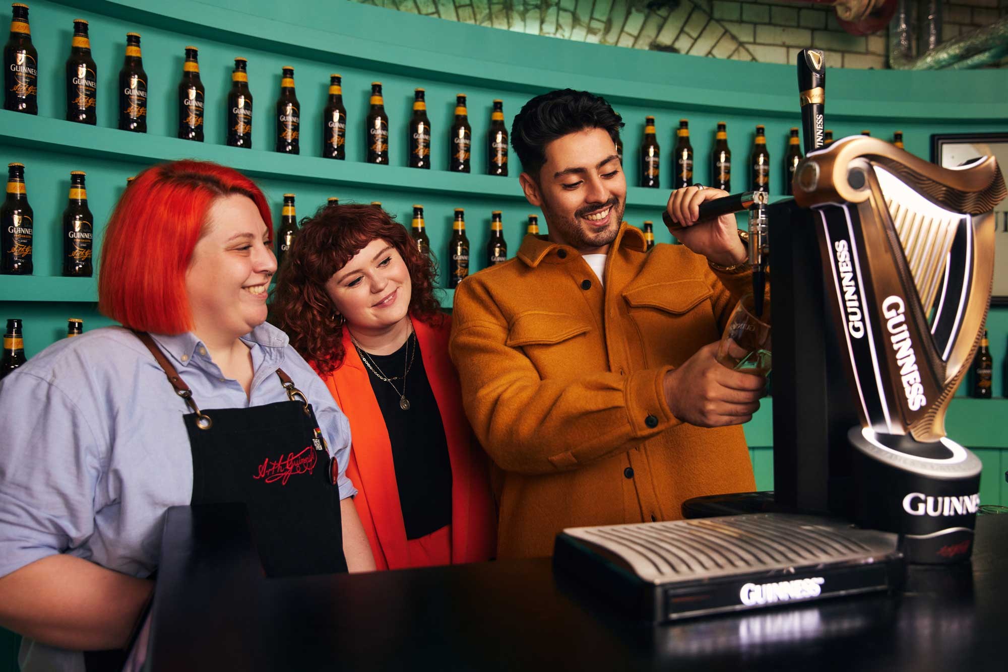 Visitors learning to pour Guinness at the Guinness Storehouse, Dublin