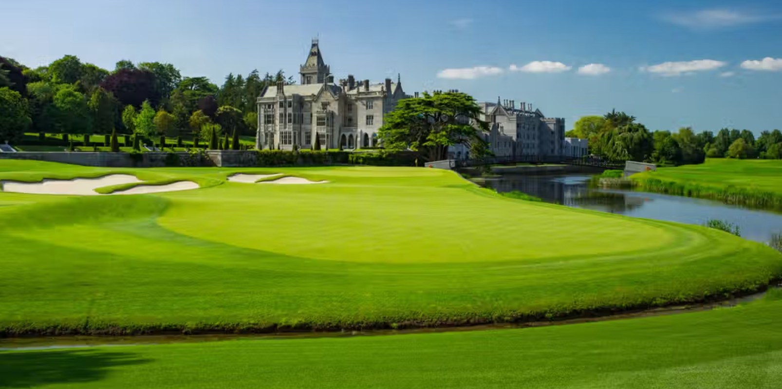 Aerial view of the Tom Fazio parkland course at Adare Manor in County Limerick, the River Maigue winding through fairways below the Gothic Revival manor house.