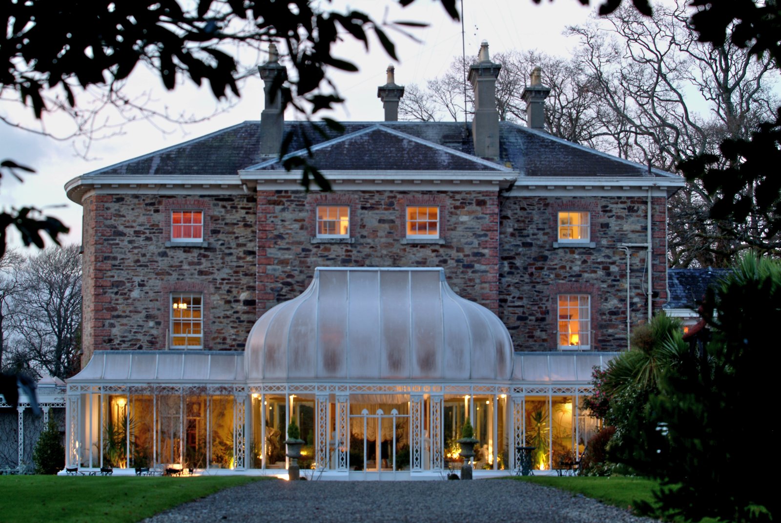 Marlfield House, Gorey, with its lit Victorian conservatory at dusk