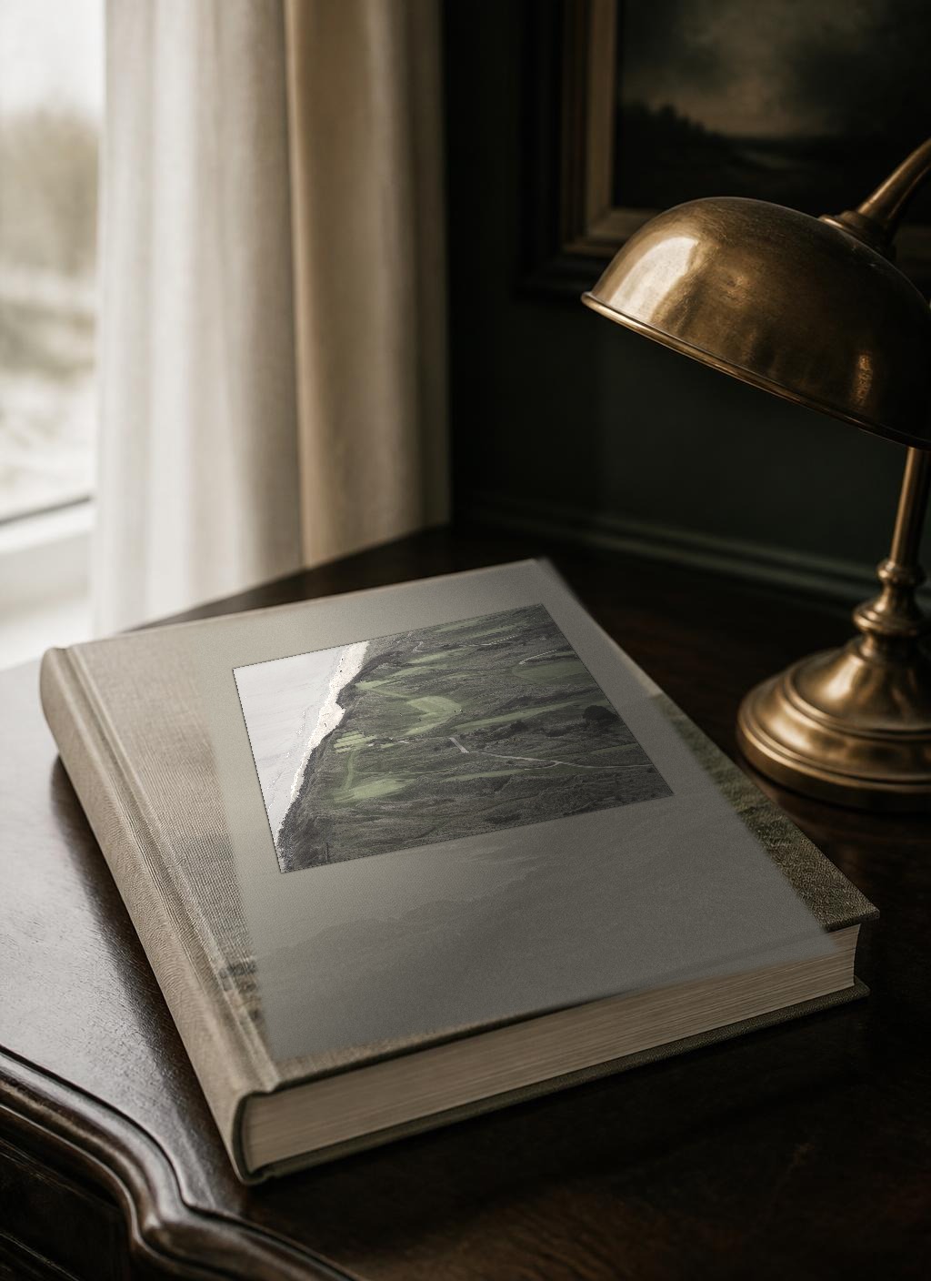 Cover of the bound printed edition N° 05, The Ireland Golf Itinerary, cover line “Greens & Gorse”, from The Ireland Edit. The linen-bound volume photographed as a physical book, with a documentary photograph of Portmarnock, County Dublin tipped into the front board.