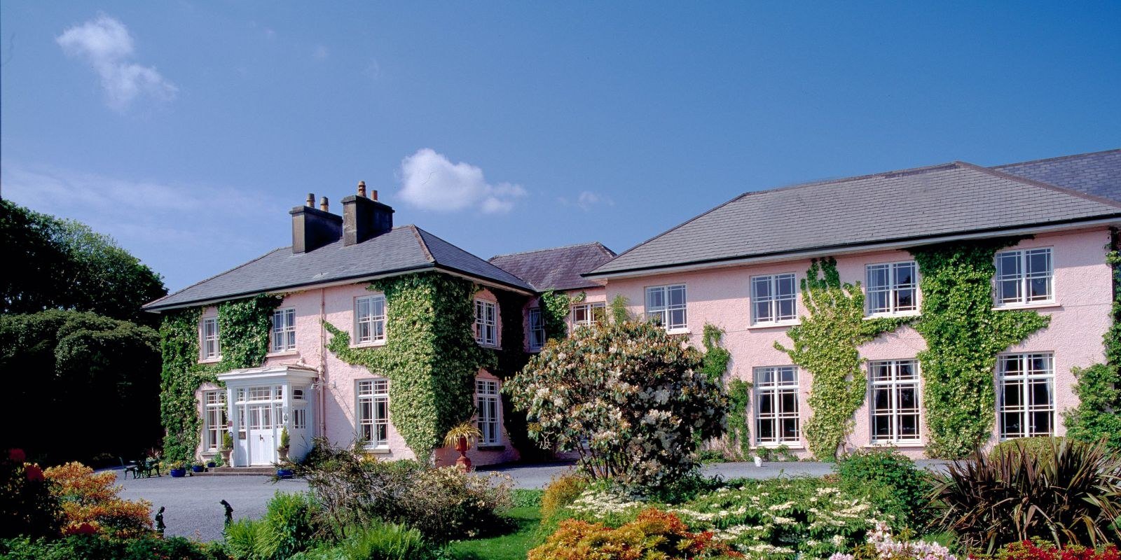 Ivy-covered country house facade of Rosleague Manor in Connemara