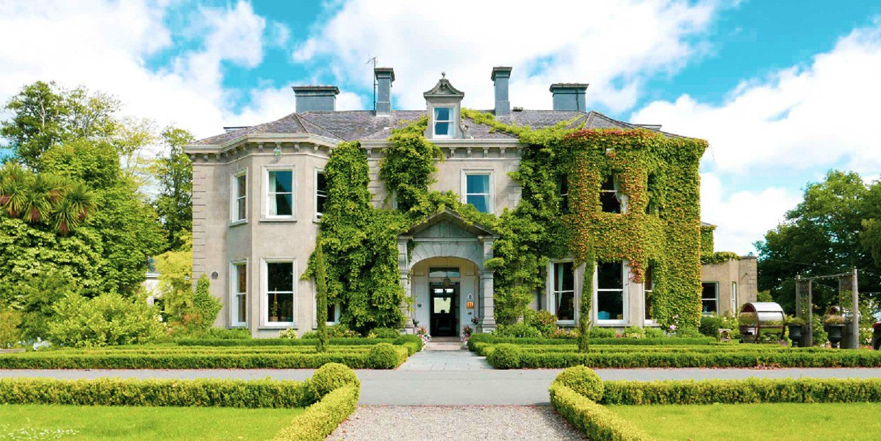 Ivy-covered Victorian facade and formal gardens at Tinakilly Country House